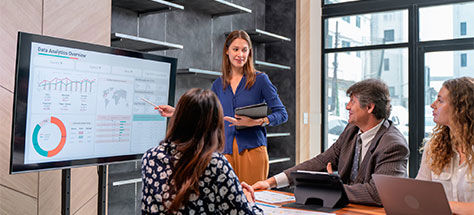 Woman Presenting To A Group Of People