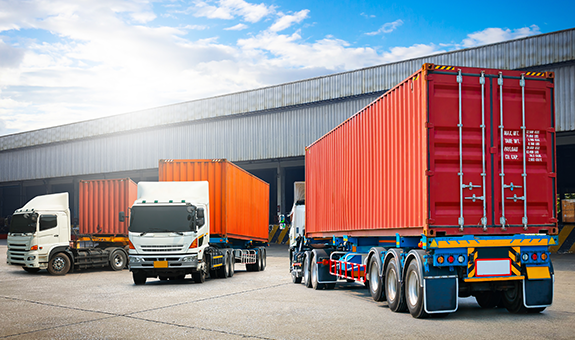 Red And Orange Trucks In A Warehouse