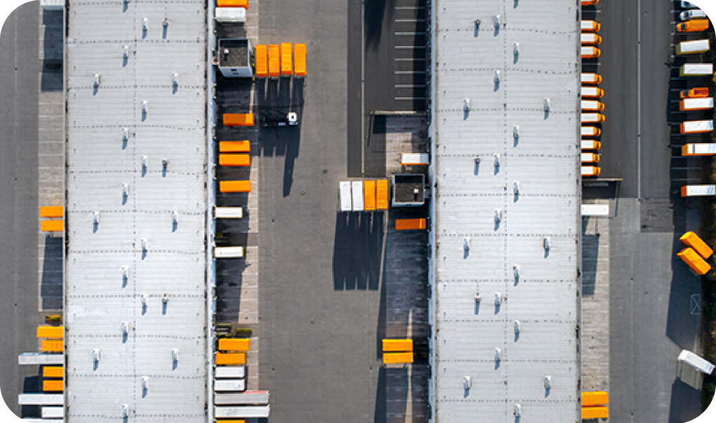 Warehouse Full Of Yellow And Orange Trucks